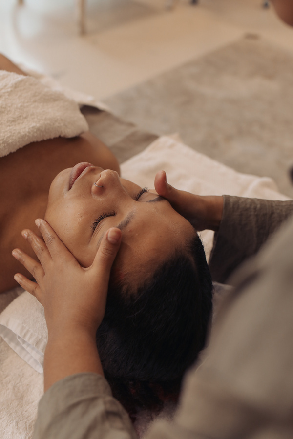 Masseuse Massaging Woman's Face